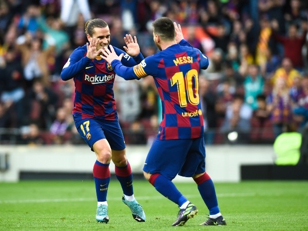 Griezmann festeja junto a Lionel Messi (Getty Images)