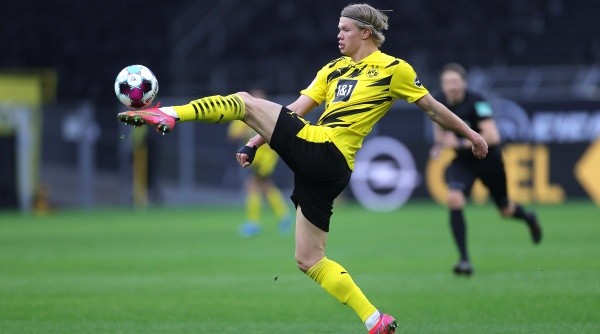 # (L) in action against # (R) during the German Bundesliga soccer match between Borussia Dortmund and Arminia Bielefeld at Signal Iduna Park in Dortmund, Germany, 27 February 2021.-Not Released (NR) DFL regulations prohibit any use of photographs as image sequences and/or quasi-video.