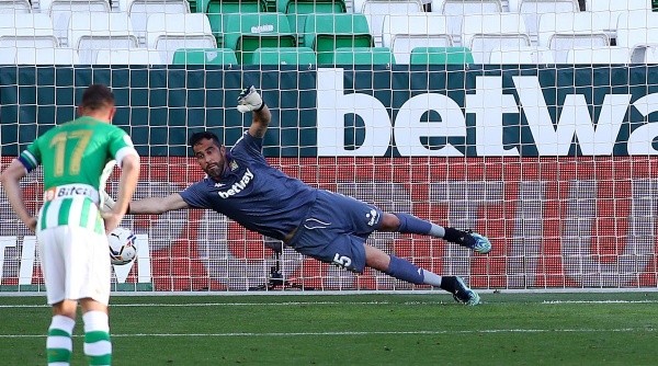 SEVILLE, SPAIN - APRIL 18: Claudio Bravo of Real Betis fails to save as Carlos Soler of Valencia CF scores their team's second goal from the penalty spot during the La Liga Santander match between Real Betis and Valencia CF at Estadio Benito Villamarin on April 18, 2021 in Seville, Spain. Sporting stadiums around Spain remain under strict restrictions due to the Coronavirus Pandemic as Government social distancing laws prohibit fans inside venues resulting in games being played behind closed doors. (Photo by Fran Santiago/Getty Images)-Not Released (NR)