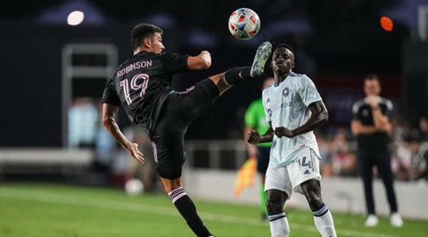 FORT LAUDERDALE, FLORIDA - AUGUST 18: Robbie Robinson #19 of Inter Miami CF kicks the ball up the field against Jhon Espinoza #14 of Chicago Fire FC during the first half at DRV PNK Stadium on August 18, 2021 in Fort Lauderdale, Florida. (Photo by Mark Brown/Getty Images)