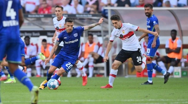 STUTTGART, GERMANY - SEPTEMBER 19: Charles Aranguiz of Bayer 04 Leverkusen and Oemer Faruk Beyaz of VfB Stuttgart compete for the ball during the Bundesliga match between VfB Stuttgart and Bayer 04 Leverkusen at Mercedes-Benz Arena on September 19, 2021 in Stuttgart, Germany. (Photo by Sebastian Widmann/Getty Images)-Not Released (NR) DFL regulations prohibit any use of photographs as image sequences and/or quasi-video.