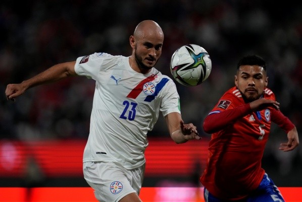 SANTIAGO, CHILE - OCTOBER 10: Carlos Gonzalez of Paraguay and Paulo Diaz of Chile fight for the ball  during a match between Chile and Paraguay as part of South American Qualifiers for Qatar 2022 at Estadio San Carlos de Apoquindo on October 10, 2021 in Santiago, Chile. (Photo by Esteban Felix - Pool/Getty Images)-Not Released (NR)